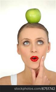 Woman with an apple on her head