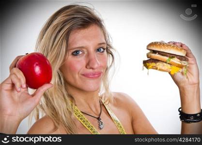 woman with apple and hamburger