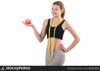 Woman with apple doing exercises on white