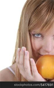 Woman with apple on white background