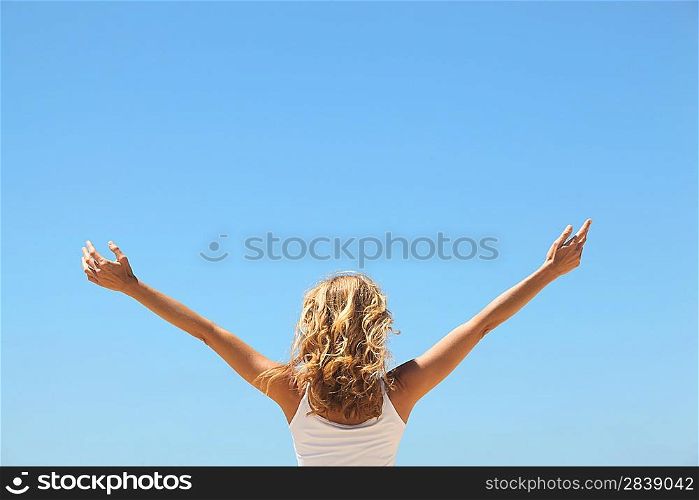 Woman with arms in the air