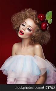 Woman with artistic make-up and cherry. Doll.