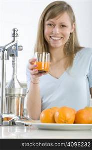 Woman with assorted citrus fruits and orange juice, isolated