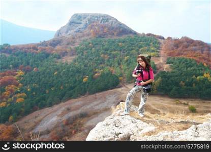 Woman with backpack viewing at the landscape