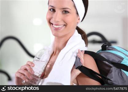 Woman with bag leaving gym