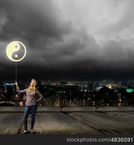 Woman with balloon. Young girl in casual and yin yang sign