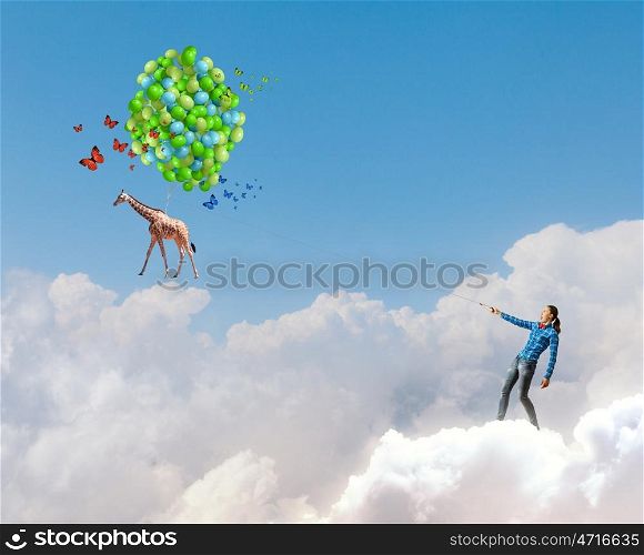 Woman with balloons. Young girl in casual with bunch of colorful balloons