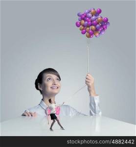 Woman with balloons. Young woman holding bunch of colorful balloons