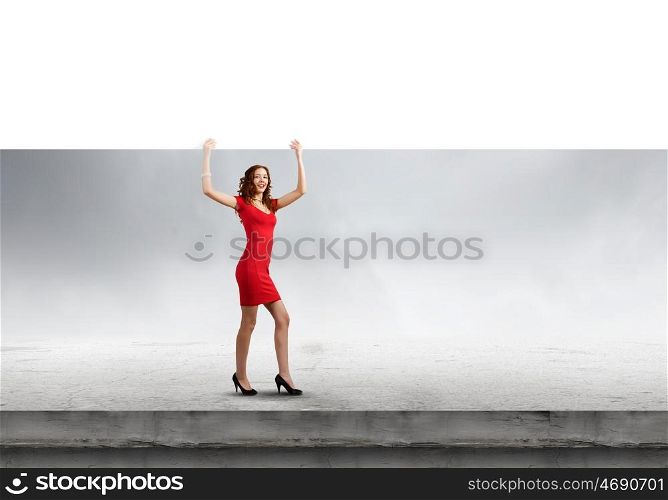 Woman with banner. Pretty woman in red dress with white blank banner