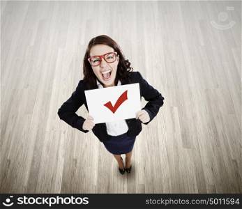 Woman with banner. Top view of businesswoman holding white banner with red tick