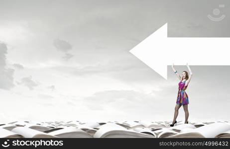 Woman with banner. Woman in multicolored dress with arrow banner in hands