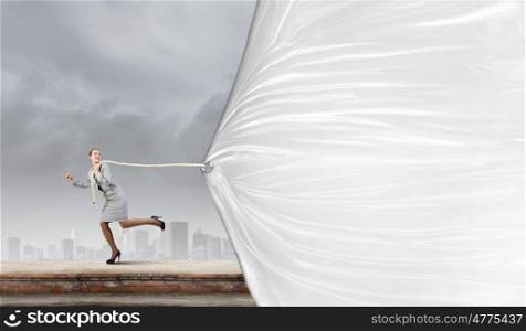 Woman with banner. Young businesswoman running and pulling white blank banner