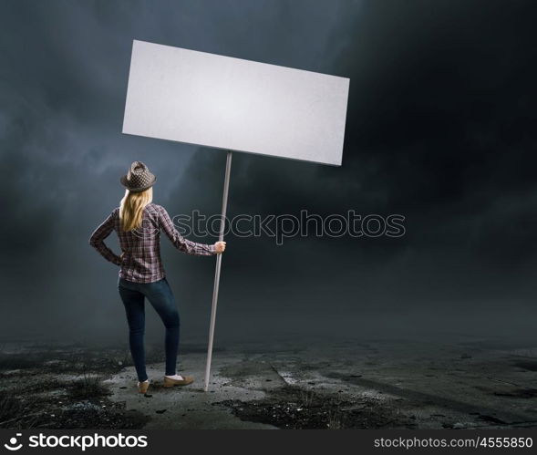 Woman with banner. Young girl in casual with white banner. Place for text