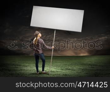 Woman with banner. Young girl in casual with white banner. Place for text