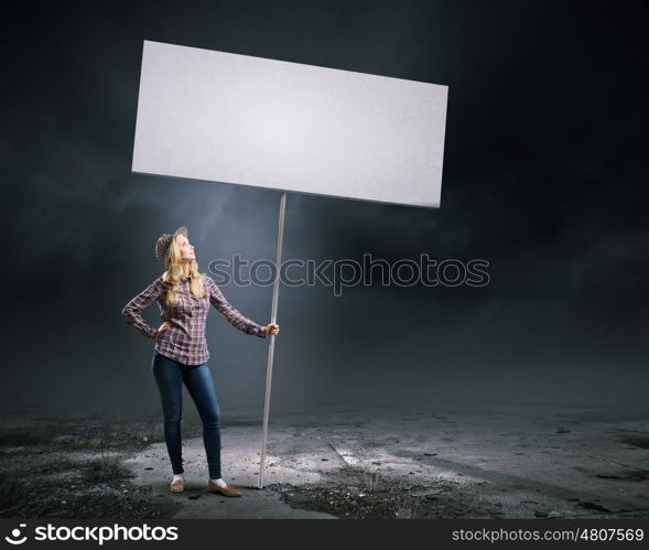 Woman with banner. Young girl in casual with white banner. Place for text