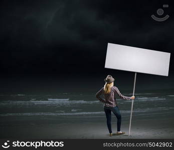 Woman with banner. Young girl in casual with white banner. Place for text