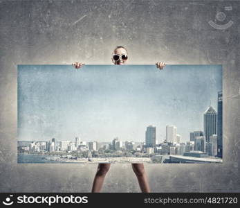 Woman with banner. Young woman showing banner with modern city scape