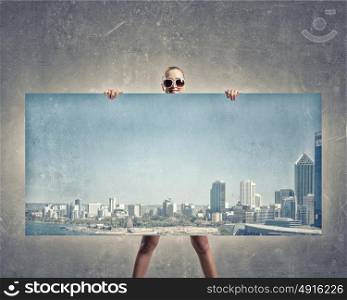 Woman with banner. Young woman showing banner with modern city scape