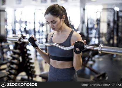 woman with barbell gym