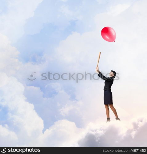 Woman with baseball bat. Young pretty woman in suit and hat with baseball bat