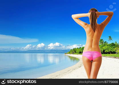 Woman with beautiful body at tropical beach. Collage.