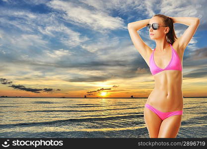 Woman with beautiful body on tropical beach at sunset. Collage.