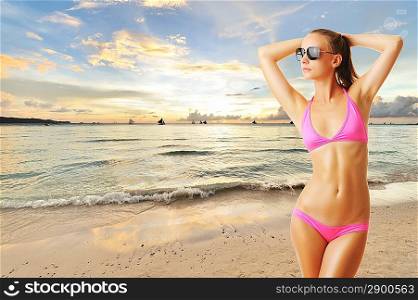 Woman with beautiful body on tropical beach at sunset. Collage.