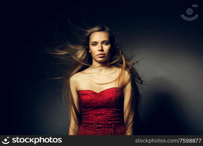 woman with beautiful long hair on wind