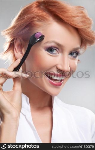 Woman with beauty tool.