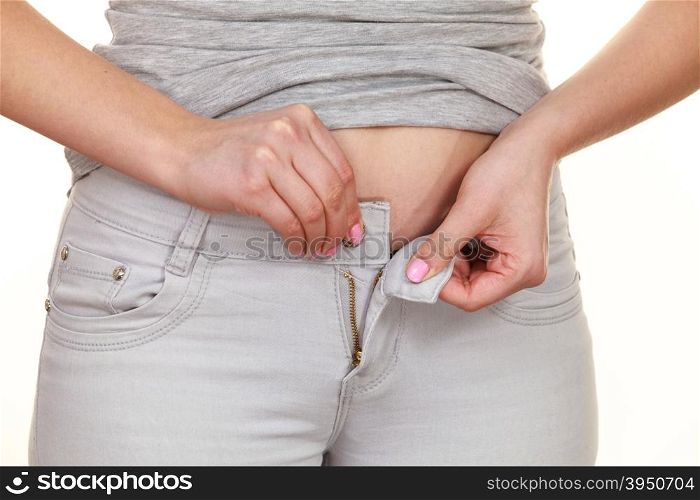Woman with belly fat unable to close the pants . Woman with belly fat getting dressed putting pants on. Overweight female trying to fasten too small trousers isolated. Weight gain diet concept