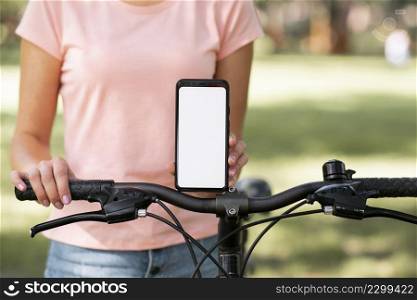woman with bicycle copy space mobile phone