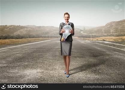 Woman with big bulb in hands. Young businesswoman carrying glass glowing light bulb in hands