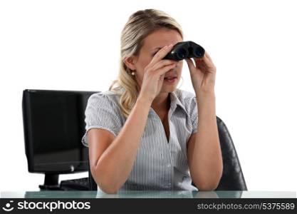 Woman with binoculars in the Office