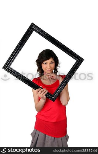 Woman with black frame in hand