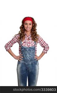 Woman with blue jeans overalls standing on white background