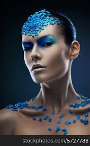 woman with blue stones on body
