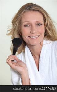 Woman with blusher brush