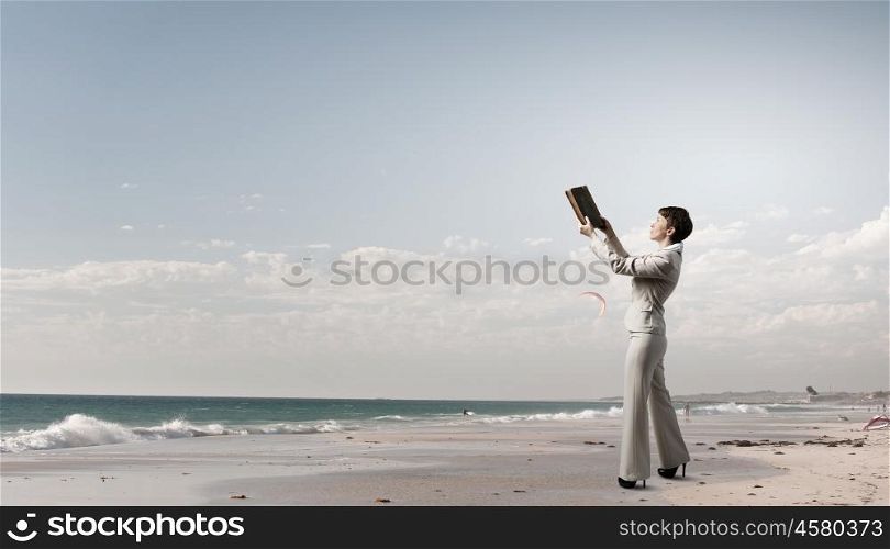 Woman with book. Adult woman in suit with old book in hand