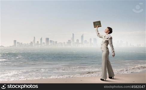 Woman with book. Adult woman in suit with old book in hand