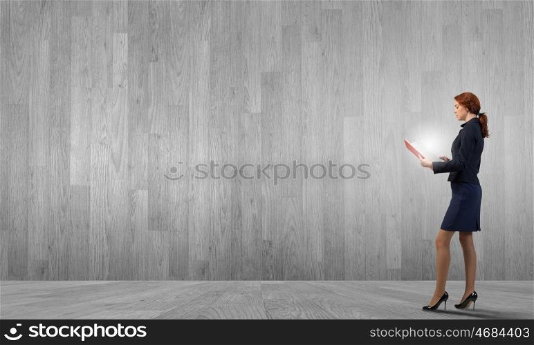 Woman with book. Young businesswoman with red book in hands