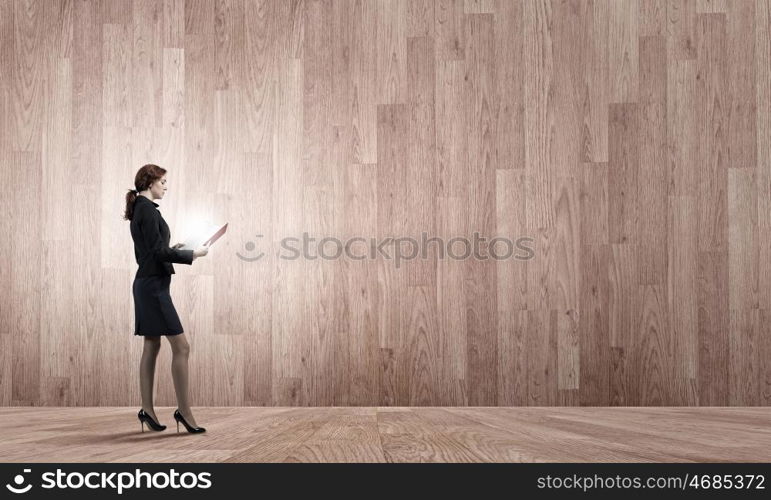 Woman with book. Young businesswoman with red book in hands