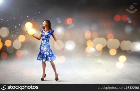 Woman with book. Young elegant lady in blue dress with book in hand