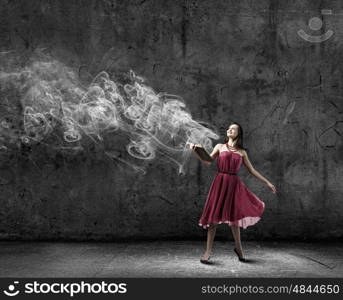 Woman with book. Young woman in red dress with book in hand