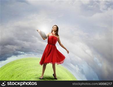 Woman with book. Young woman in red dress with book in hand