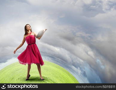 Woman with book. Young woman in red dress with book in hand