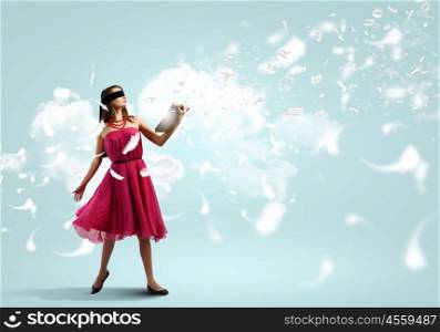 Woman with book. Young woman in red dress with book wearing blindfold
