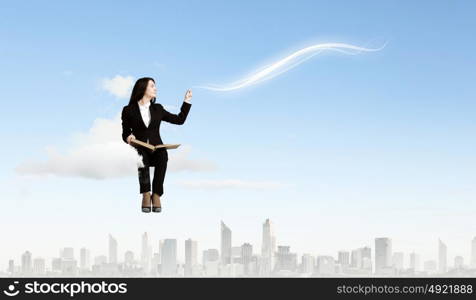 Woman with book. Young woman sitting on cloud with book in hands