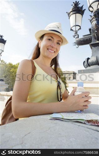 woman with bottle of cold water