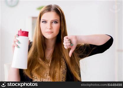 Woman with bottle of cream in make-up concept