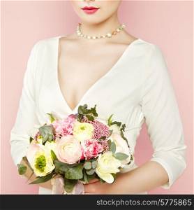 Woman with bouquet of flowers in her hands. Flowers. Spring. Bride. March 8. Fashion photo